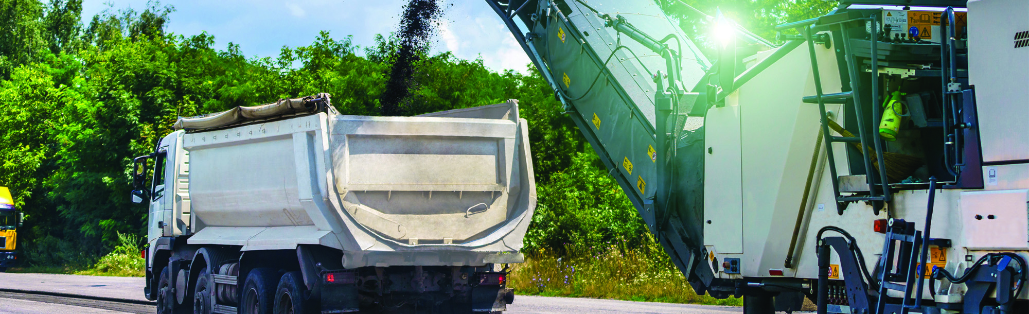 Heavy special machines. Asphalt heavy machinery in operation. Side view. Closeup.